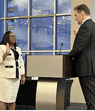 Harris County Clerk Teneshia Hudspeth was sworn in as
iGO president by Patrick Bond, General Counsel, on July 23.