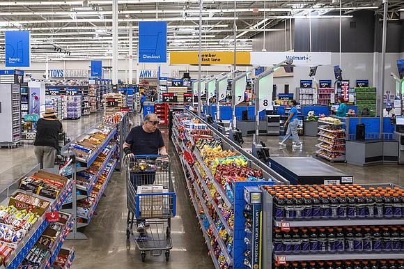 Americans are cutting back on Disney parks, Big Macs and Starbucks coffee. But they keep shopping at Walmart.