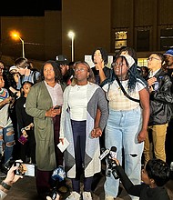 Kylah Spring, center, is seen speaking at a march against racism on University of Kentucky's campus on Monday, Nov. 7, 2022 in Lexington, Kentucky. She was working at a dorm when she was verbally attacked by a White student who was intoxicated.
Mandatory Credit:	Monica Kast/Lexington Herald-Leader/AP via CNN Newsource