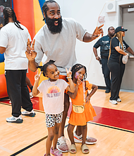 NBA All-Star James Harden grabs a pic with some little fans at his Impact13 Foundation’s 6th Annual JH-Town Weekend.
 
Photo: Courtesy of Impact13 Foundation