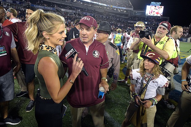 Samantha Ponder, pictured interviewing then-Florida State head coach Jimbo Fisher after a game in 2016, has been fired by ESPN.
Mandatory Credit:	Phelan M. Ebenhack/AP via CNN Newsource
