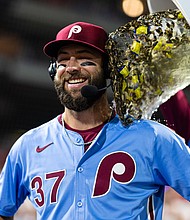 Wilson is doused after hitting for the cycle.
Mandatory Credit:	Bill Streicher/USA Today/Reuters via CNN Newsource