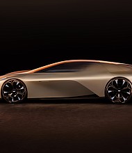 Side view of Cadillac Opulent Velocity concept vehicle in Gilded Pearl exterior color.