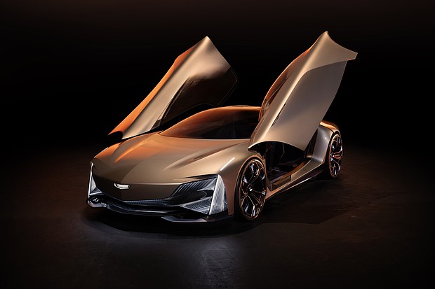 Front 3/4 view of Cadillac Opulent Velocity concept vehicle with open butterfly doors.