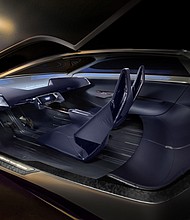 Interior view of Cadillac Opulent Velocity concept vehicle in Selene Metallic dark blue, featuring 2+2 seating configuration .