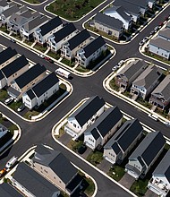 Vice President Kamala Harris plans to announce her campaign's four-year plan to lower housing costs, and pictured are single-family homes in a residential neighborhood in Aldie, Virginia on May 22.
Mandatory Credit:	Nathan Howard/Bloomberg/Getty Images via CNN Newsource