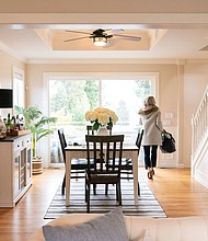 A realtor walks through the dining room during an open house at a home in Seattle, Washington, on March 26, and the National Association of Realtors agreed to settle litigation over commission rules for US real estate agents, clearing the way for possible changes in how Americans buy and sell homes.
Mandatory Credit:	David Ryder/Bloomberg/Getty Images via CNN Newsource