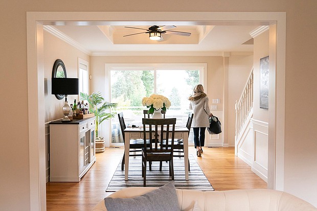 A realtor walks through the dining room during an open house at a home in Seattle, Washington, on March 26, and the National Association of Realtors agreed to settle litigation over commission rules for US real estate agents, clearing the way for possible changes in how Americans buy and sell homes.
Mandatory Credit:	David Ryder/Bloomberg/Getty Images via CNN Newsource