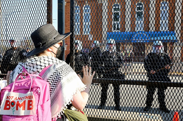 Riot police are on the scene after protestors from the first national March on the DNC broke down the fence barrier surrounding the perimeter of the United Center from Park 578, Chicago, IL on August 19, 2024.
Mandatory Credit:	Alexandra Buxbaum/SIPAPRE/AP via CNN Newsource