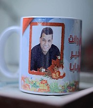 A mug with a image of Akram Abu Tabaq, Sham’s father and Sanaa’s husband, who was shot dead while trying to return home during the November ceasefire in Gaza.
Mandatory Credit:	CNN via CNN Newsource