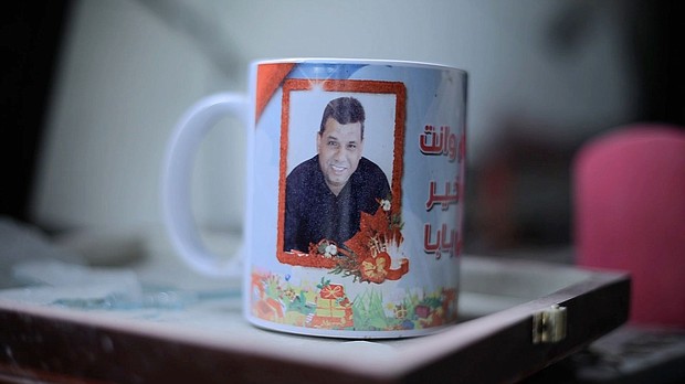 A mug with a image of Akram Abu Tabaq, Sham’s father and Sanaa’s husband, who was shot dead while trying to return home during the November ceasefire in Gaza.
Mandatory Credit:	CNN via CNN Newsource