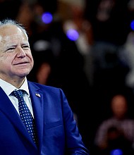 U.S. Democratic vice presidential nominee Minnesota Governor Tim Walz attend a campaign rally in Milwaukee, Wisconsin, U.S. August 20.
Mandatory Credit:	Marco Bello/Reuters via CNN Newsource