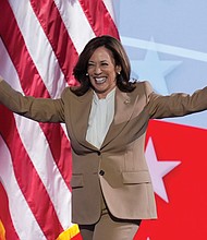 Democratic presidential nominee Vice President Kamala Harris walks on stage Monday during the Democratic National Convention Chicago.