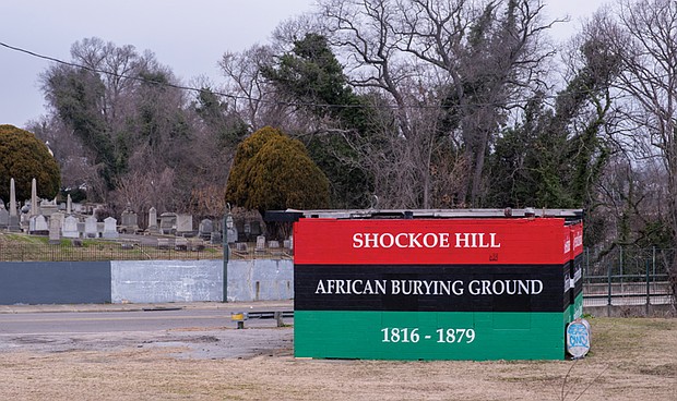 A mural covers an abandoned gas station that sits on top of graves in the Shockoe Hill African Burying Ground at 1305 N. 5th St.
