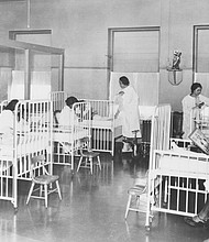 Nurses attend to patients in this historical photo of the children’s ward inside Wheatley-Provident Hospital, a Black hospital in Kansas City, Mo. It opened in 1918, but like most Black hospitals, it closed following the federal campaign to desegregate hospitals in the 1960s.