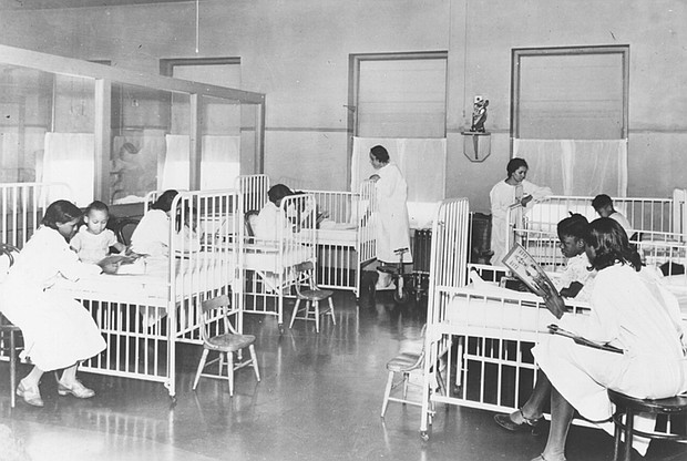Nurses attend to patients in this historical photo of the children’s ward inside Wheatley-Provident Hospital, a Black hospital in Kansas City, Mo. It opened in 1918, but like most Black hospitals, it closed following the federal campaign to desegregate hospitals in the 1960s.