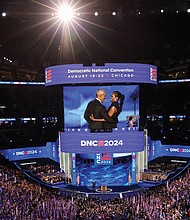 Former President Obama and former First Lady Michelle Obama admire each other on stage Aug. 20 at the second day of the Democratic National Convention in Chicago.