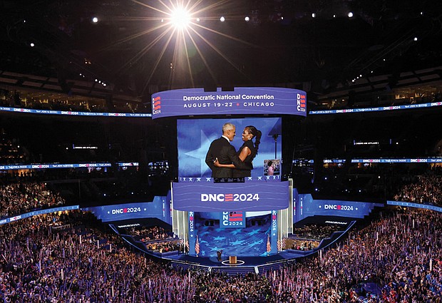 Former President Obama and former First Lady Michelle Obama admire each other on stage Aug. 20 at the second day of the Democratic National Convention in Chicago.