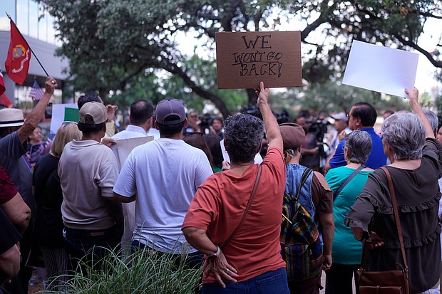 Supporters attend a news conference where officials with the League of United Latin American Citizens, or LULAC, responded to allegations by Texas Attorney General Ken Paxton, on Monday in San Antonio.
Mandatory Credit:	Eric Gay/AP via CNN Newsource