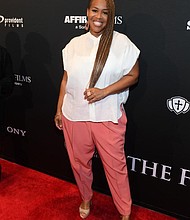 Acclaimed Grammy award-winning artist Tina Campbell makes a stunning entrance at the star-studded red carpet premiere of Sony Pictures' AFFIRM Films' "The Forge" movie in Atlanta, GA.