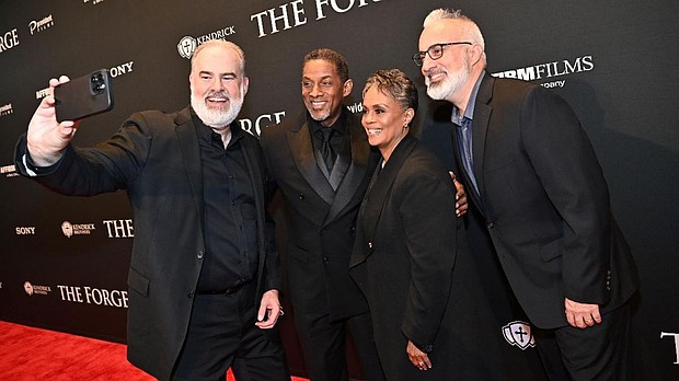 [L-R] Director Alex Kendrick, actor Cameron Arnett, actress BJ Arnett, and producer Stephen Kendrick take a quick selfie on the red carpet at the premiere of "The Forge," a Sony Pictures' AFFIRM Films movie, in Atlanta, GA.