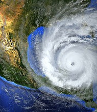 hurricane approaching the American continent visible above the Earth, a view from the satellite. Elements of this image furnished by NASA.