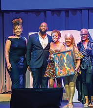 Elegba Folklore Society founder Janine Bell along with daughtes Imani Bell and grand- daughter Yaa-Nailah Bell-Barber accept the Cultural Preservation Award at the inaugural BLK RVA Community Awards this past Friday night at The Hippodrome Theater. Also pictured, Anissa Turner Randolph, chair of the BLK RVA Advisory Board, Greg Gallop, philanthropic associate of The Community Foundation and show host Clovia Lawrence.