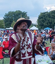 Nate Fleming enjoys the sounds of the Down Home Family Reunion before rainfall halted the annual event.