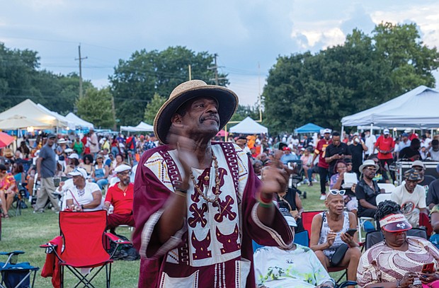 Nate Fleming enjoys the sounds of the Down Home Family Reunion before rainfall halted the annual event.