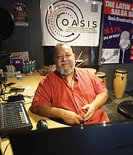 Luis “Sweet Lou” Hidalgo, founder of the 17th Annual Latin Jazz and Salsa Festival, at his Oasis Broadcasting Network studio. This year’s festival, “Rumba en la Market,” will be held at the 17th Street Market in Shockoe Bottom on Saturday, Aug. 31, from noon to 8 p.m.