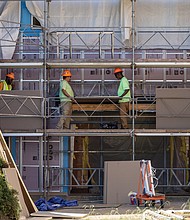 Construction workers at John Marshall High School on Aug. 22, as Richmond Public Schools announces $15.3 million
federal grant for HVAC upgrades and other infrastructure improvements.