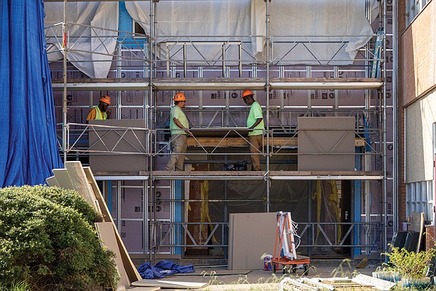 Construction workers at John Marshall High School on Aug. 22, as Richmond Public Schools announces $15.3 million
federal grant for HVAC upgrades and other infrastructure improvements.