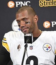 Pittsburgh Steelers quarterback Russell Wilson addresses the media Aug. 24 after an NFL preseason football game against the Detroit Lions in Detroit.
