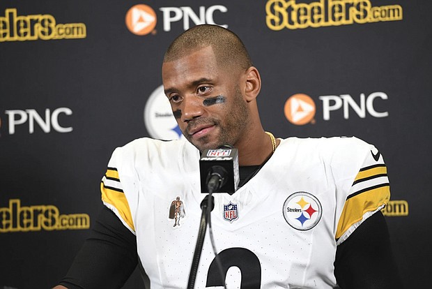 Pittsburgh Steelers quarterback Russell Wilson addresses the media Aug. 24 after an NFL preseason football game against the Detroit Lions in Detroit.