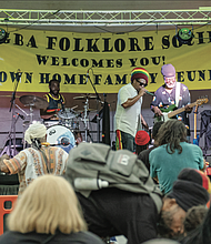 Reggae band Wildfire performs, right, during the 33rd Down Home Family Reunion in Abner Clay Park in Jackson Ward on Aug. 17.