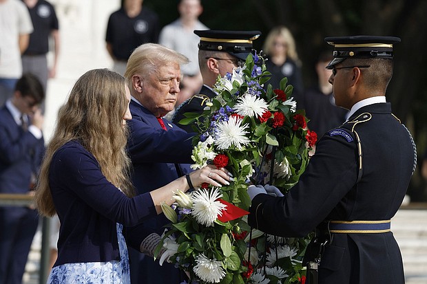 Former U.S. President Donald Trump stands alongside Misty Fuoco, whose sister Sgt. Nicole Gee died in Abbey Gate Bombing, at a wreath-laying ceremony at the Tomb of the Unknown Soldier at Arlington National Cemetery on August 26 in Arlington, Virginia.
Mandatory Credit:	Anna Moneymaker/Getty Images via CNN Newsource
