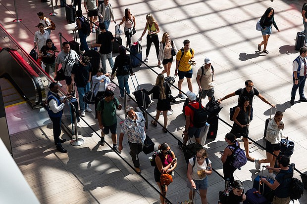 People line up in Moynihan Train Hall in New York City before the start of the 2023 Labor Day holiday weekend. This year's holiday weekend will be even busier, AAA says.
Mandatory Credit:	Spencer Platt/Getty Images via CNN Newsource