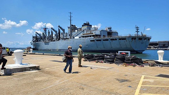 Family and friends of crew members on the USNS Supply were eager to get on board and greet their loved …