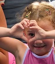 The young tennis fan motions to Sabalenka after the match.
Mandatory Credit:	Julia Nikhinson/AP via CNN Newsource