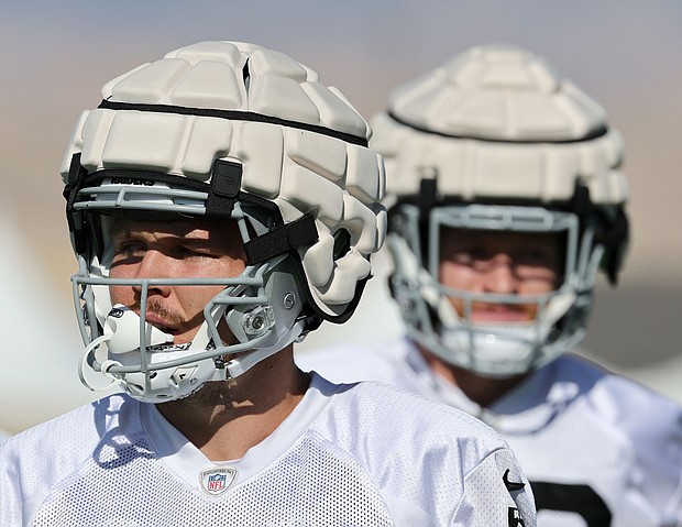 Tight ends Jesper Horsted #80 and Nick Bowers #82 of the Las Vegas Raiders wear Guardian Caps as they practice during training camp at the Las Vegas Raiders Headquarters/Intermountain Healthcare Performance Center on August 01, 2022 in Henderson, Nevada.
Mandatory Credit:	Ethan Miller/Getty Images North America/Getty Images via CNN Newsource