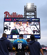Players and fans stand for a moment of silence for NHL player Johnny Gaudreau who passed away the night before the game between the Philadelphia Phillies and the Atlanta Braves at Citizens Bank Park in Philadelphia, Pennsylvania, on Friday, August 30.
Mandatory Credit:	Bill Streicher/USA Today Sports/Reuters via CNN Newsource