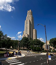 University of Pittsburgh police arrested a person suspected of attacking a group of Jewish students with a bottle on August 30, and the Cathedral of Learning is pictured towering over the University of Pittsburgh campus on July 8, 2019.
Mandatory Credit:	Gene J. Puskar/AP/File via CNN Newsource