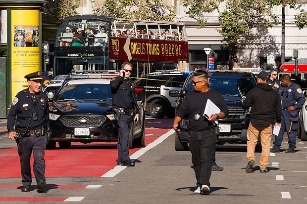 Police officers secure the area and investigate the scene of a shooting at Union Square in San Francisco on August 31.
Mandatory Credit:	Santiago Mejia/San Francisco Chronicle/Getty Images via CNN Newsource