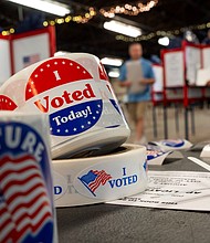 The first swing state ballots hitting mailboxes shortly after the Labor Day holiday weekend, people are pictured preparing to cast their ballots in Michigan on August 6.
Mandatory Credit:	Ryan Garza/Detroit Free Press/USA Today Network via CNN Newsource