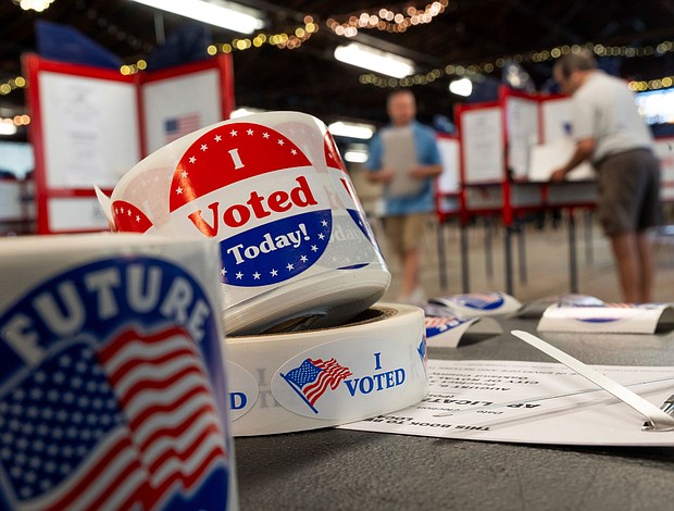 The first swing state ballots hitting mailboxes shortly after the Labor Day holiday weekend, people are pictured preparing to cast their ballots in Michigan on August 6.
Mandatory Credit:	Ryan Garza/Detroit Free Press/USA Today Network via CNN Newsource