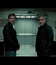 Brad Pitt and George Clooney in "Wolfs."
Mandatory Credit:	Courtesy Apple Original Films / Columbia Pictures via CNN Newsource
