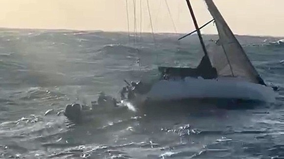 Two people have been rescued after a terrifying night at sea as six-meter (20-foot) waves tossed their stricken yacht nearly …