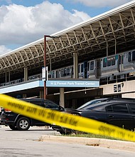 Yellow tape blocks off the parking lot of the Forest Park Blue Line train station in Forest Park, Illinois, after four people were fatally shot on a train on September 2.
Mandatory Credit:	Pat Nabong/Chicago Sun-Times/AP via CNN Newsource