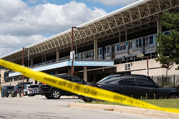 Yellow tape blocks off the parking lot of the Forest Park Blue Line train station in Forest Park, Illinois, after four people were fatally shot on a train on September 2.
Mandatory Credit:	Pat Nabong/Chicago Sun-Times/AP via CNN Newsource