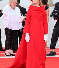 Isabelle Huppert's Balenciaga couture opera coat was inspired by theater goers of the 1950s.
Mandatory Credit:	JB Lacroix/FilmMagic/Getty Images via CNN Newsource